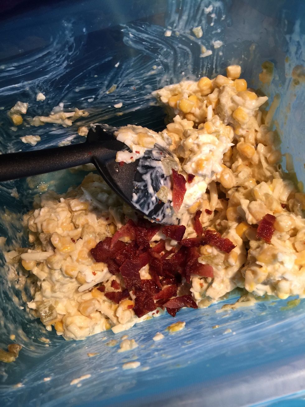 Crumble bacon add in mixture. Save about two strips for topping