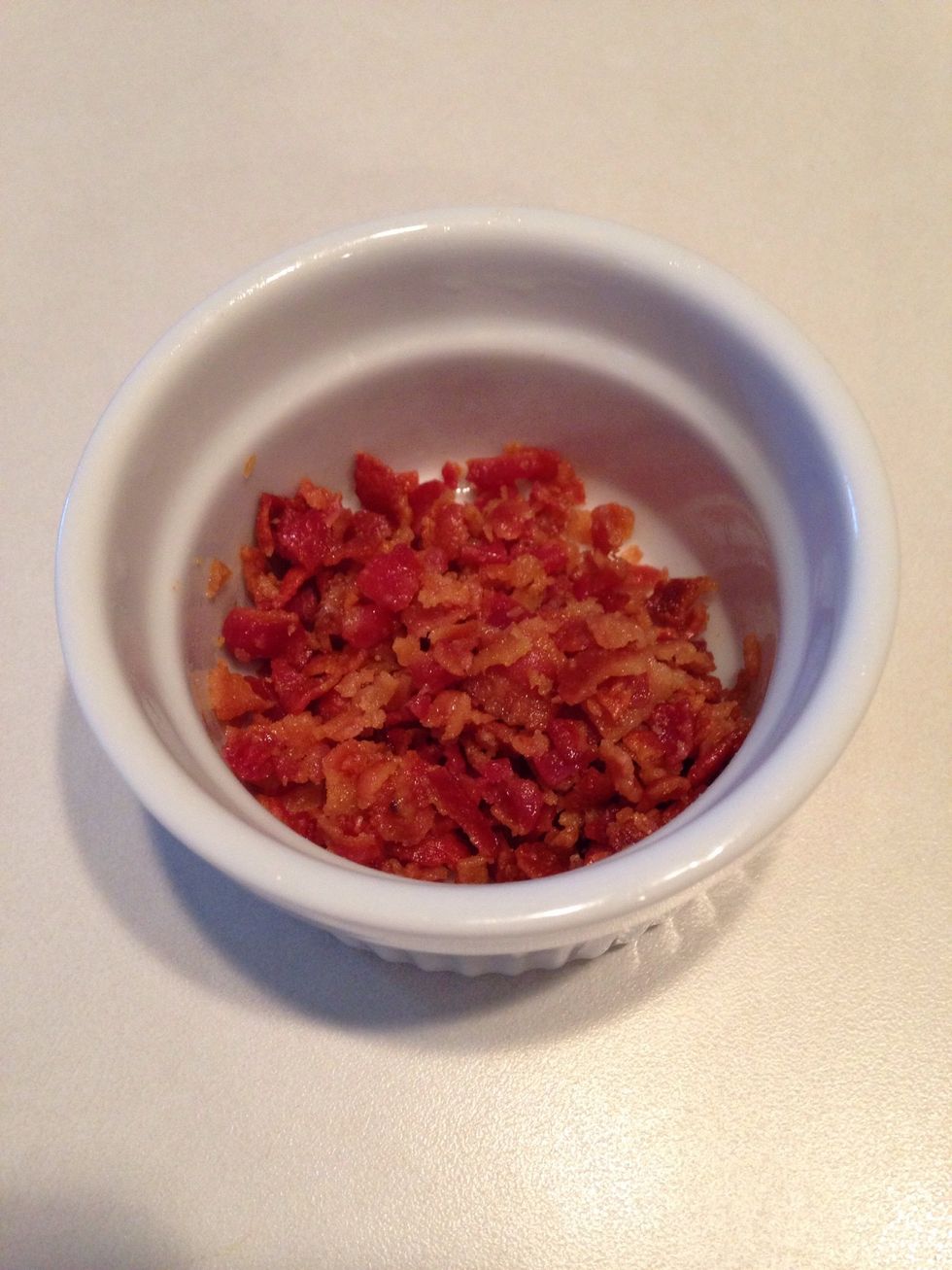 Crumble cooked bacon.