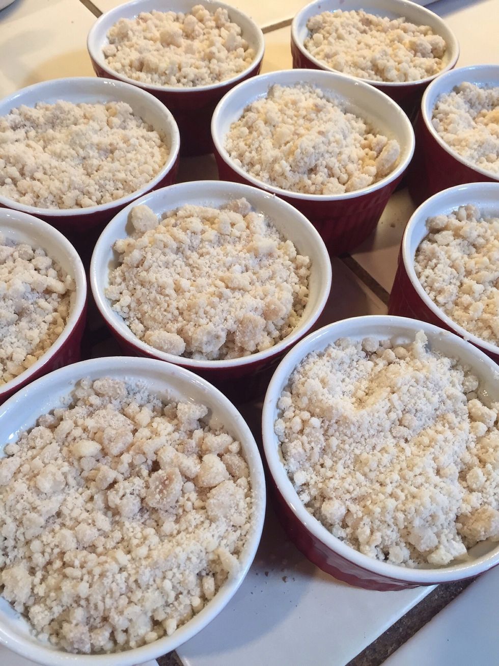 Crumble dough over berries.