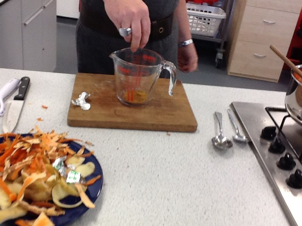 Crumble stock cube into the measuring jug.