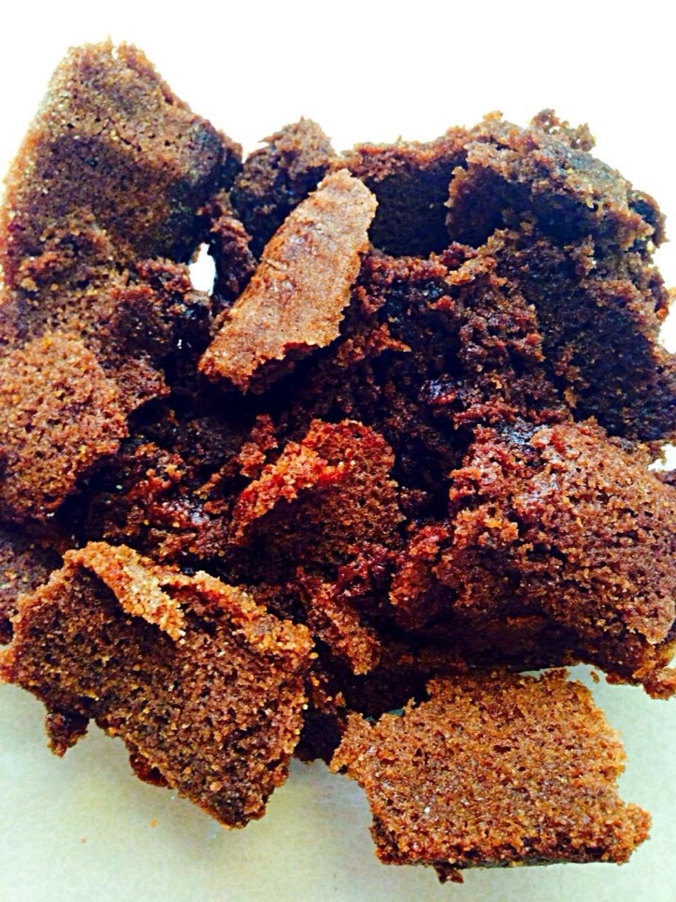 Crumble the cake with your hands. If it's a leftover cake crumble it with it's icing