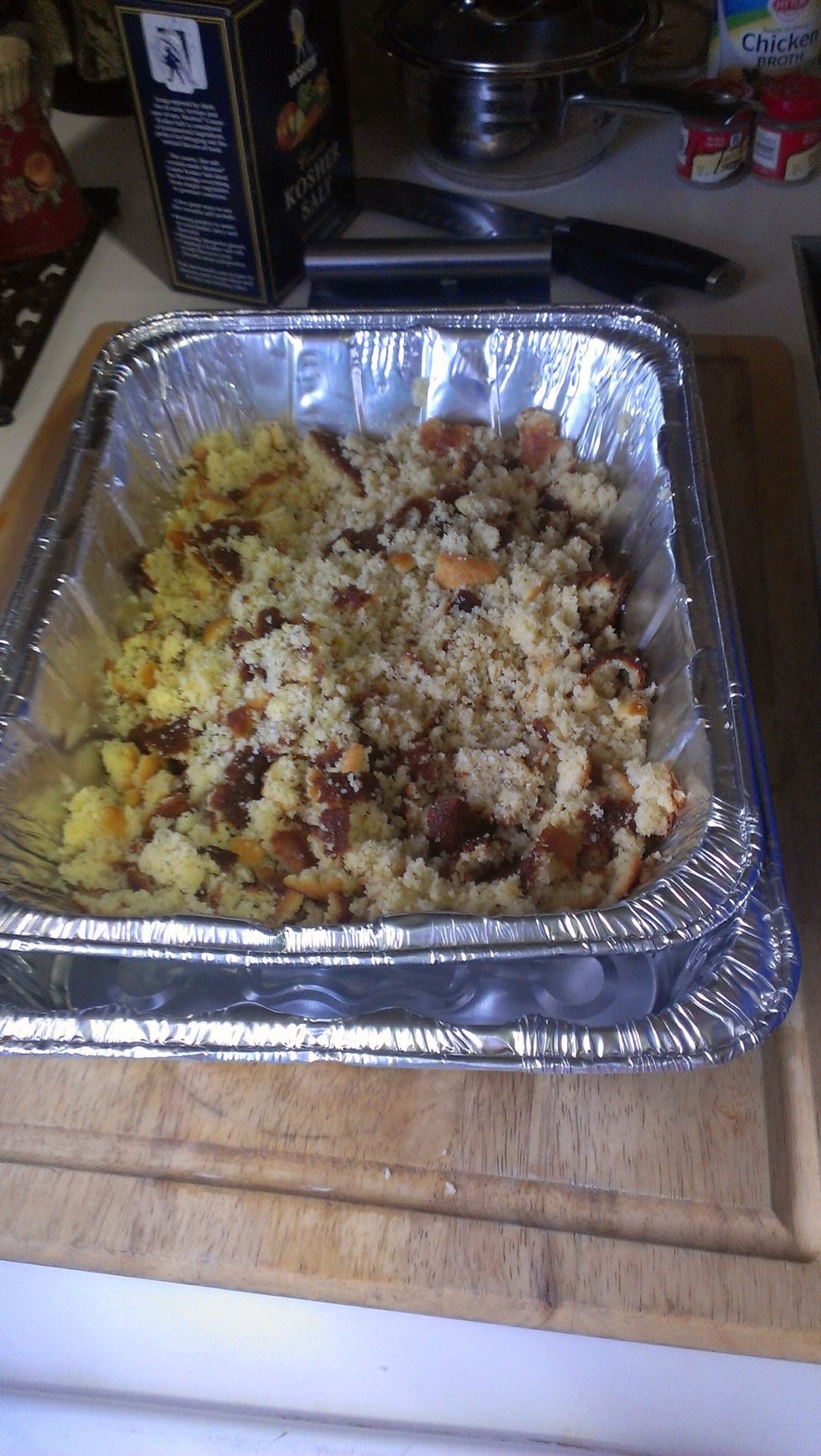 Crumble up the cornbread in the baking dish