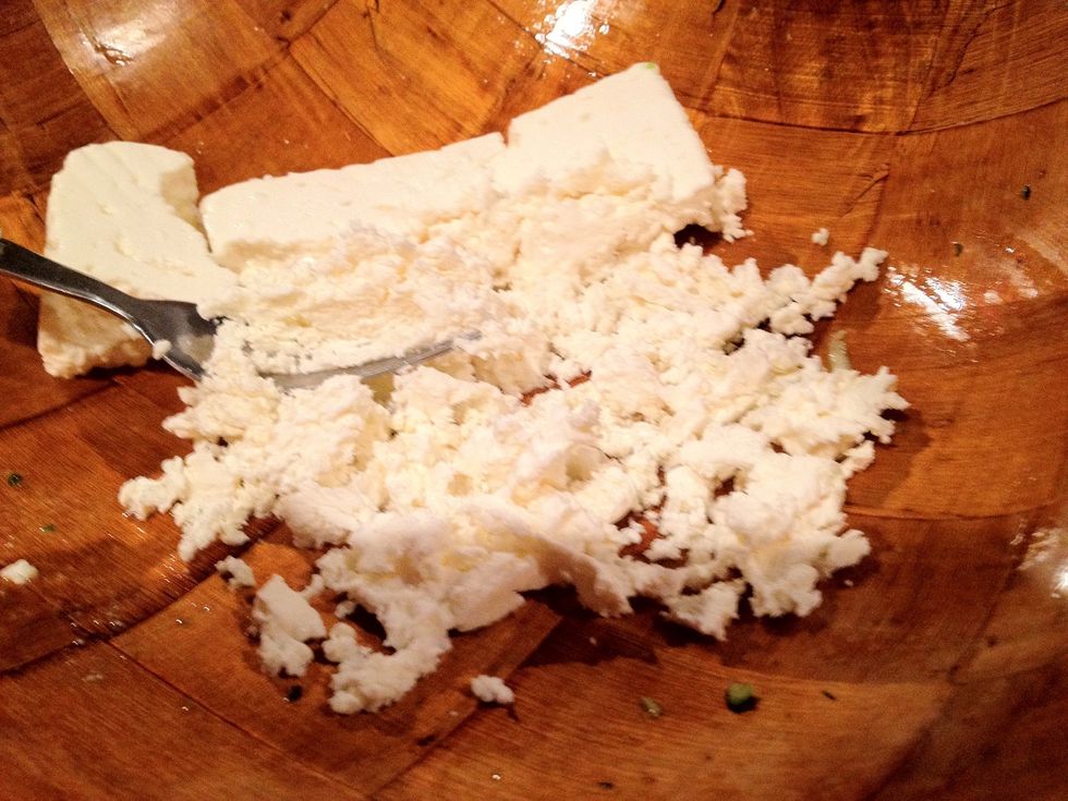 Crumble your white cheese with a fork.
