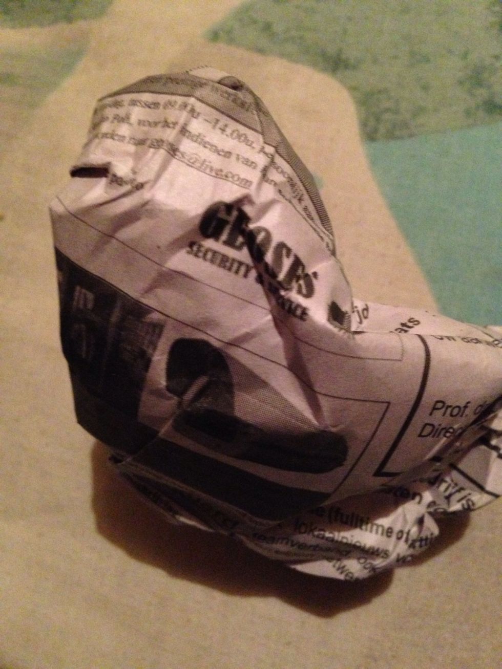 Crumple up the newspaper, like I did, look for a garbagecan and dispose of the newspaper and it's contents.  Good luck!!