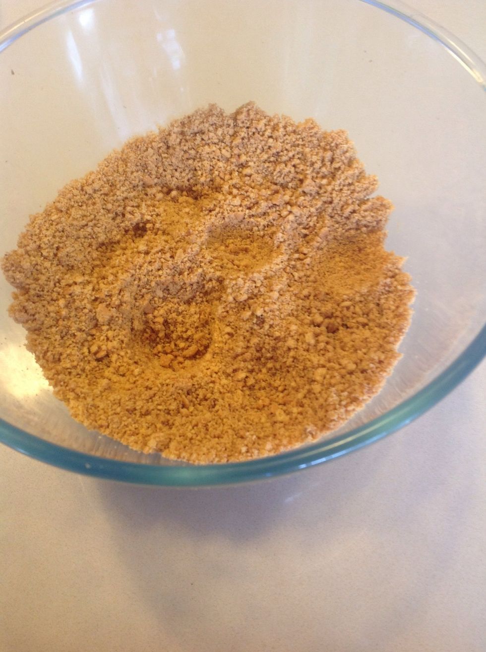 Crush biscuits and add a touch of mixed spice