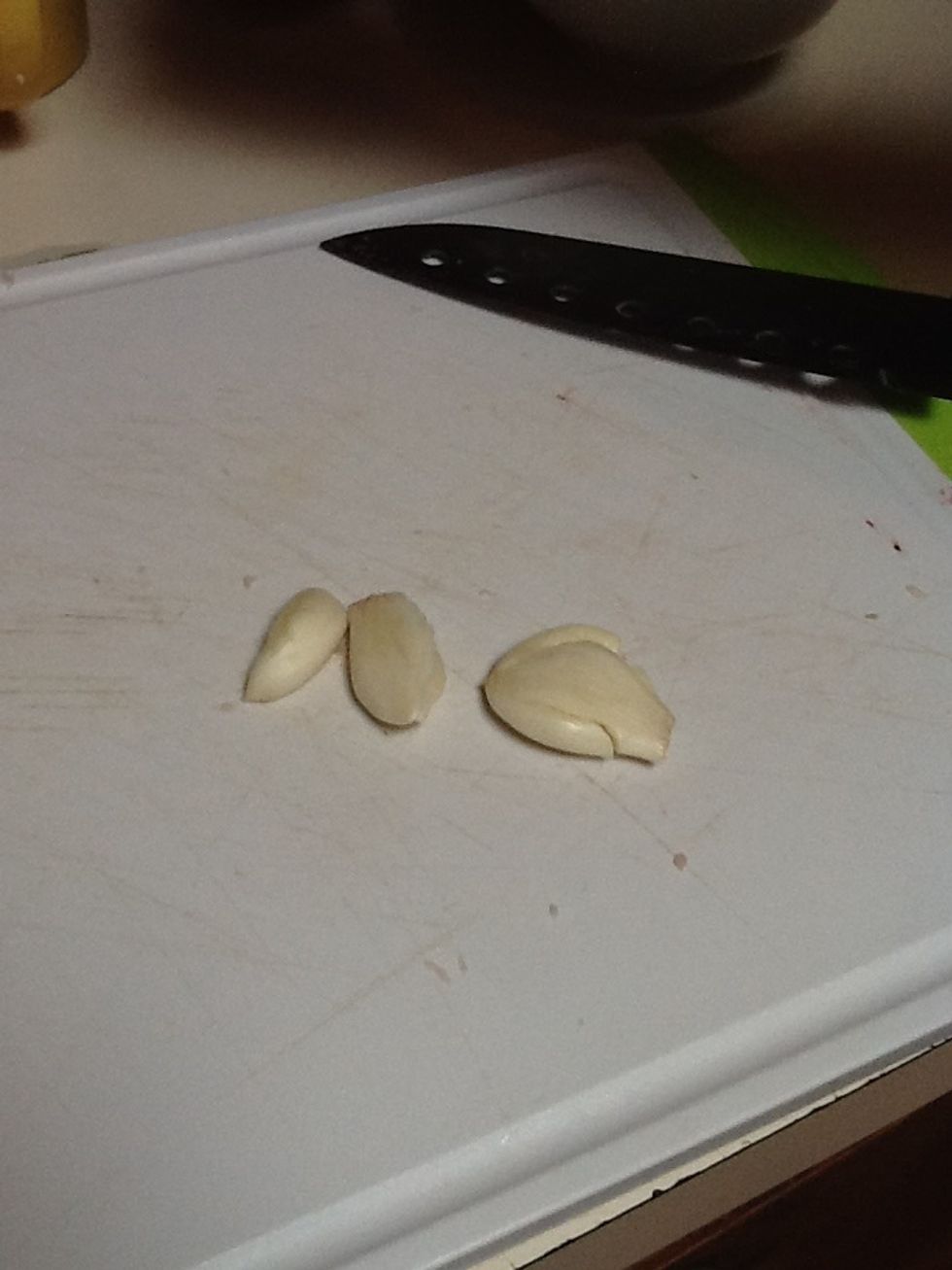 Crush garlic and peel.