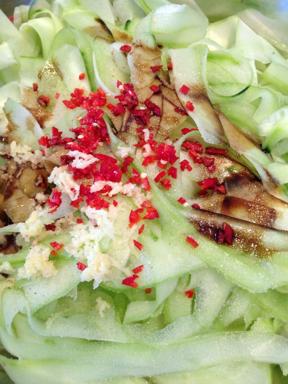 Crush garlic and put soya sauce, sesame oil and fish sauce