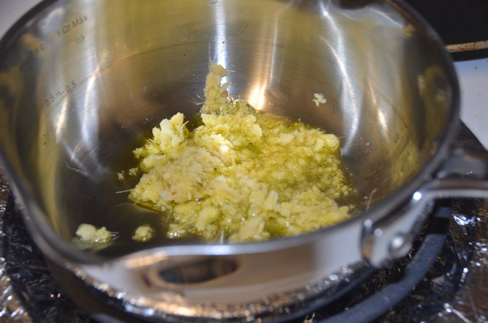 Crush ginger and garlic together. Heat olive oil on a medium heat and add the ginger garlic paste. Saut\u00e9 for 3min.