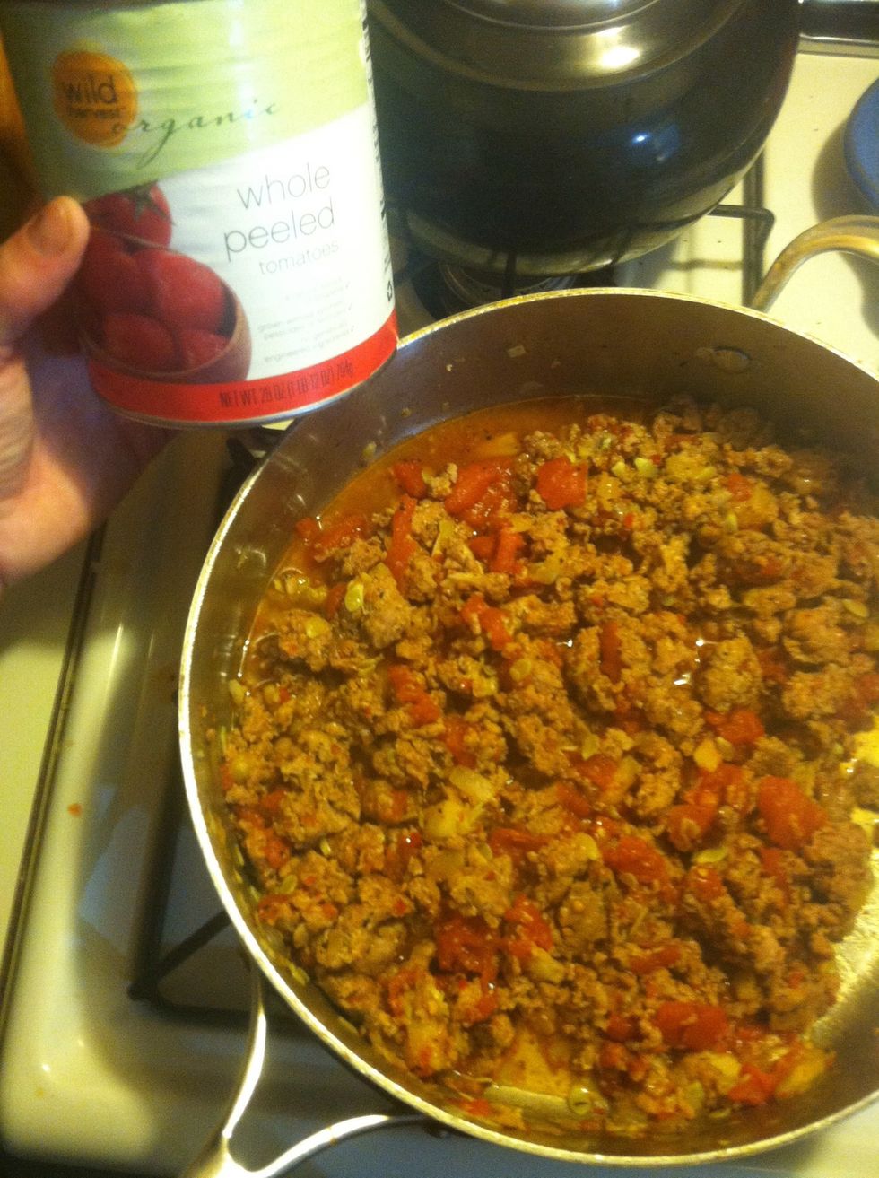 Crush in tomatoes and basil. Warm on low for 5 mins