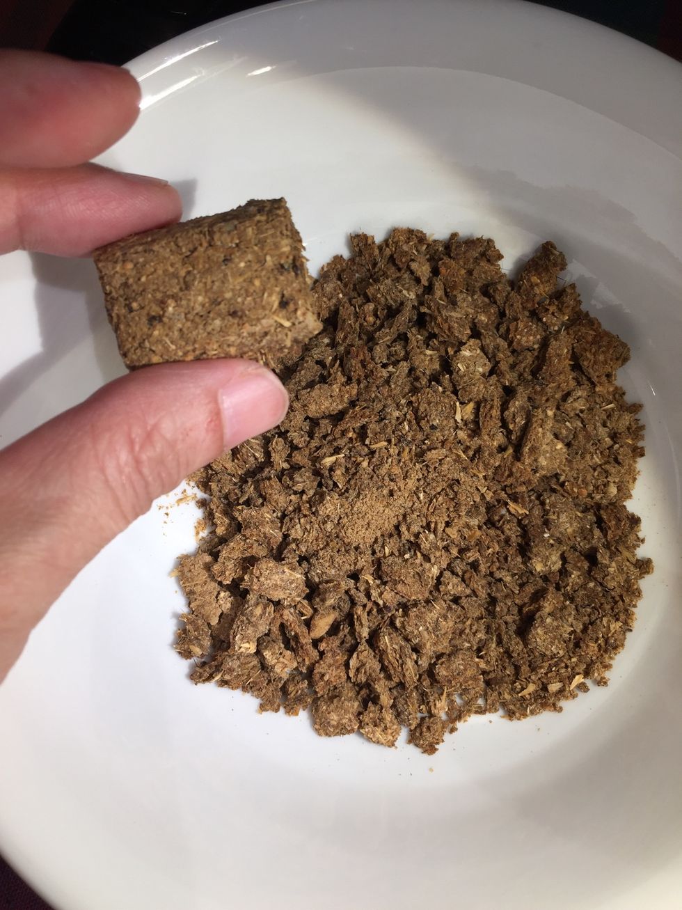 Crush some dog biscuits using a rolling pin or mortar and pestle.
