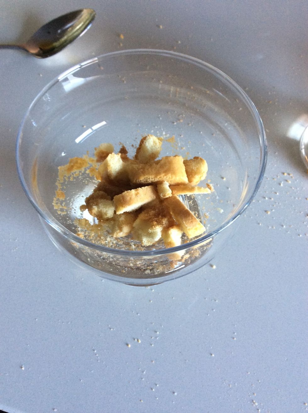 Crush the biscuits and moisten with espresso coffee