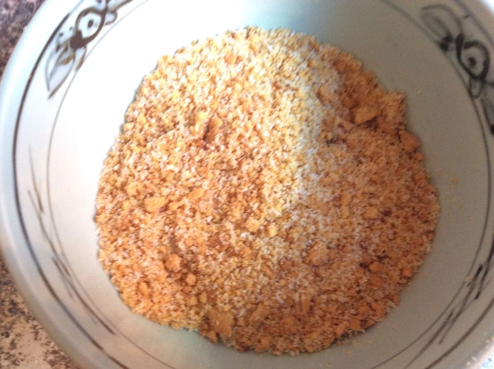 Crush the biscuits into the coconut with your hands