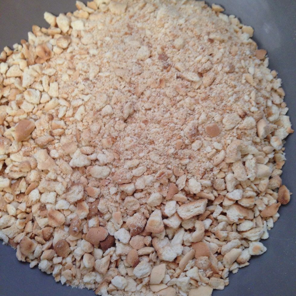 Crush the crackers with hand or using a food processor\ufffc. If you don't have graham crackers, animal crackers, biscotti  or any other hard cookie can be a good substitute