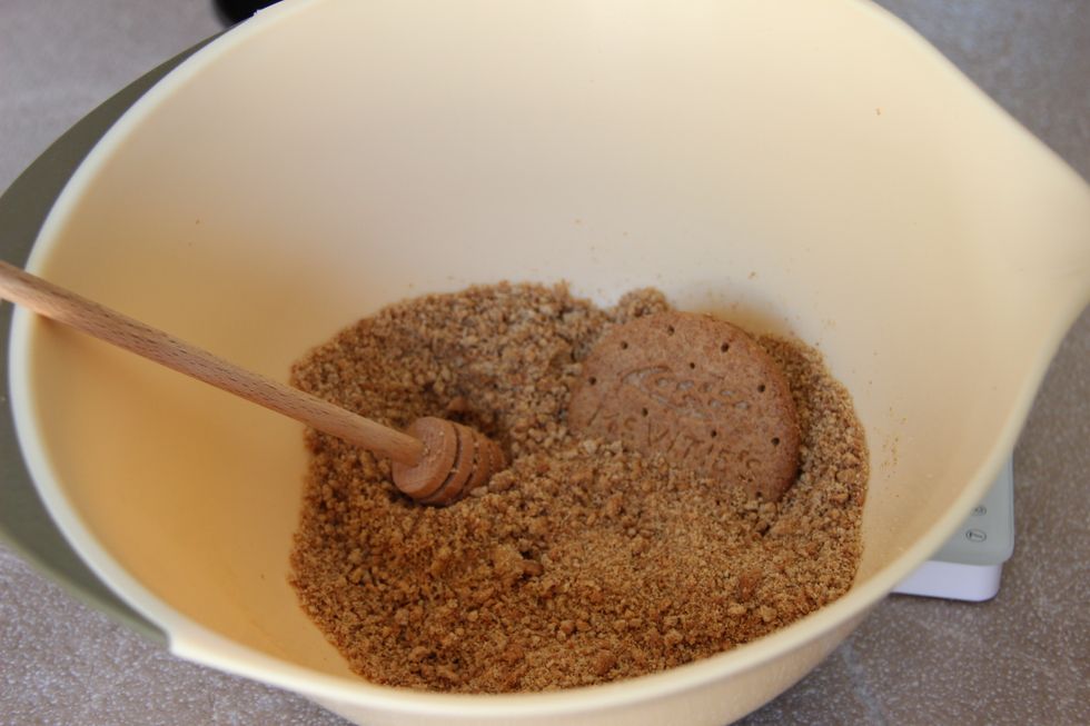 Crush the digestive biscuits by hand or using a food processor