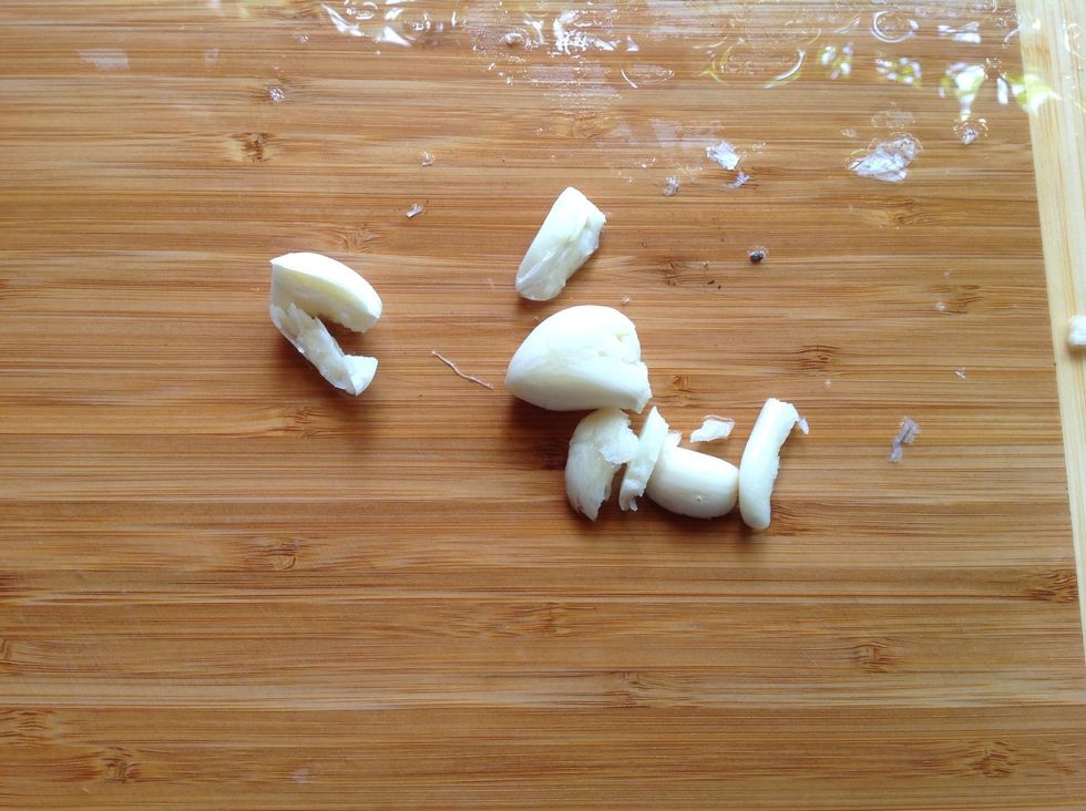Crush the garlic to get it out, it's generally easier that way