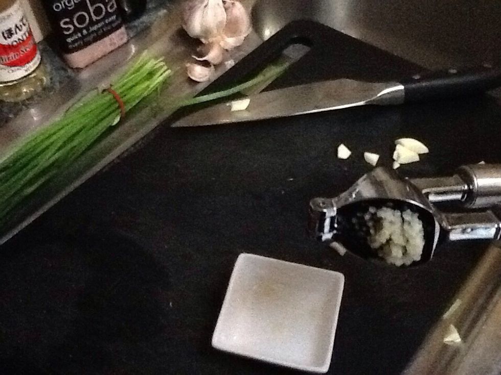 Crush the garlic.