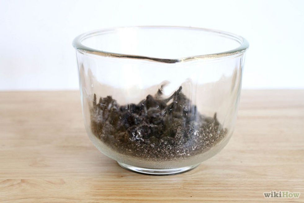 Crush the Oreo cookies into fine crumbs.