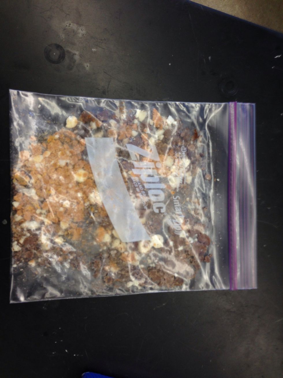 Crush the sediments using the palms of your hands or by carefully using a textbook to press down on them. Do not use a cellular device or anything else because the bag can tear.