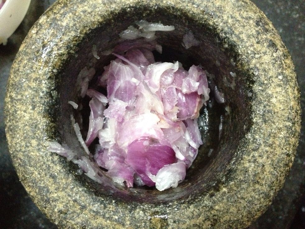 Crush the small onions (sambar onions)
