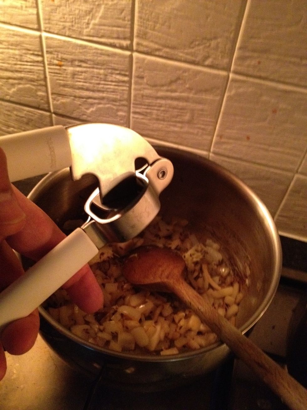 Crush your garlic in. I like a lot of garlic, feel free to use a bit less. Stir.