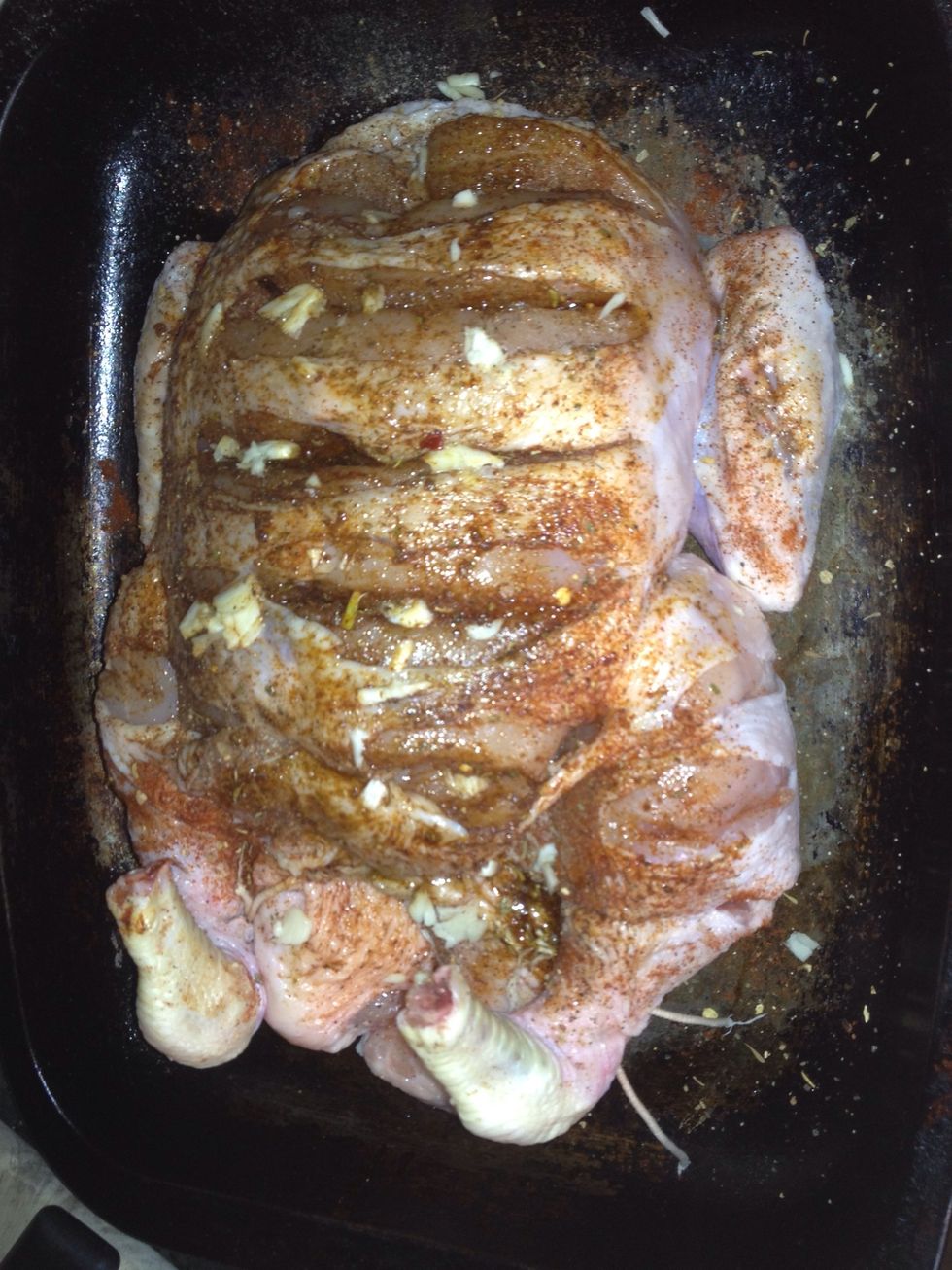 Crush your garlic with the flat of your knife and push the chunks right into the chicken. Any spare chunks go straight up the chooks arse.