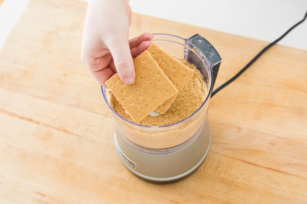 Crush your graham crackers in a ziplock bag or a small food processor.