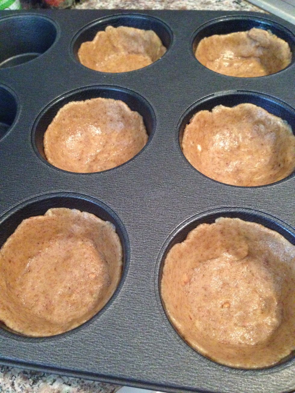 CRUST: fit the dough balls to the muffin cups