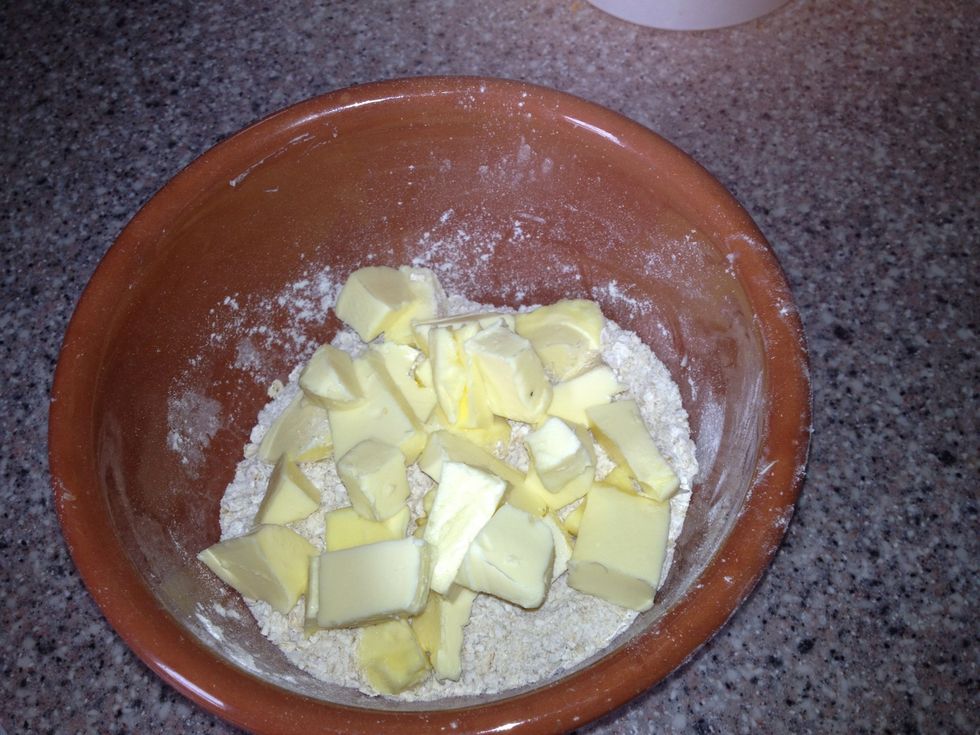 Cube butter and add to the bowl