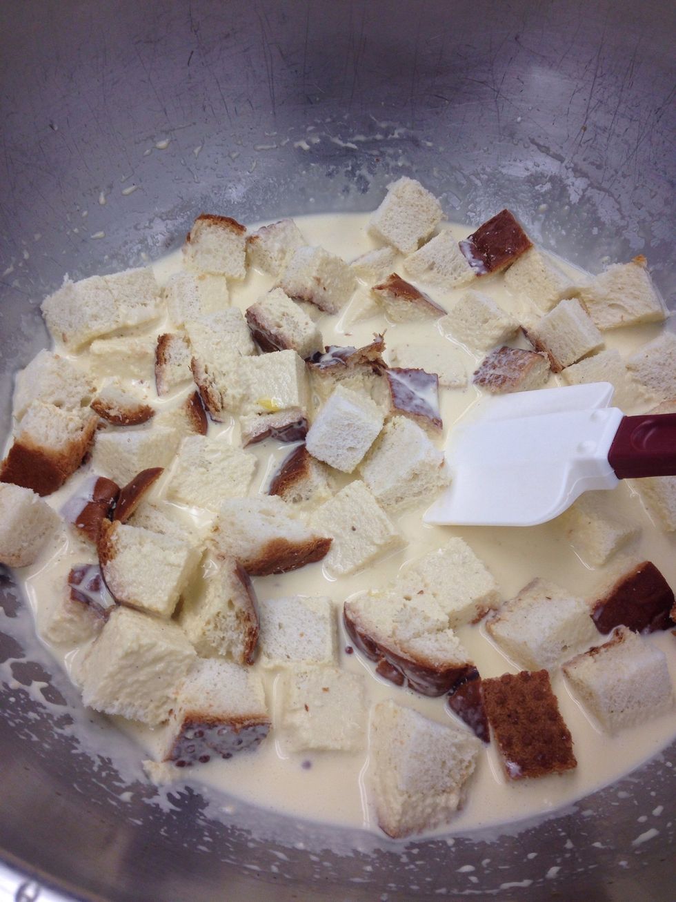 Cube the loaf of bread and add it to the egg base.