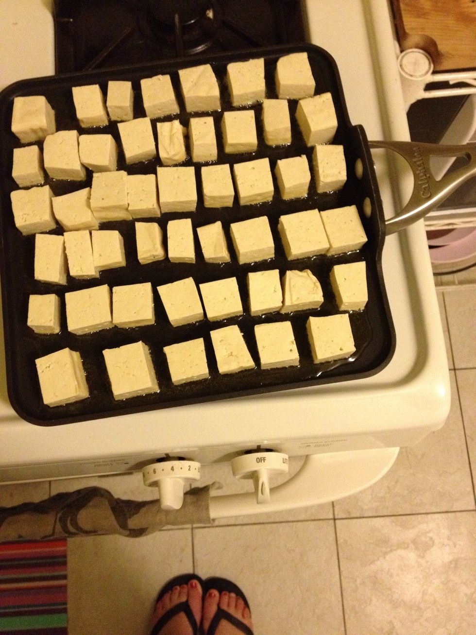 cube your tofu block and pan fry in a bit of olive oil and sesame oil.