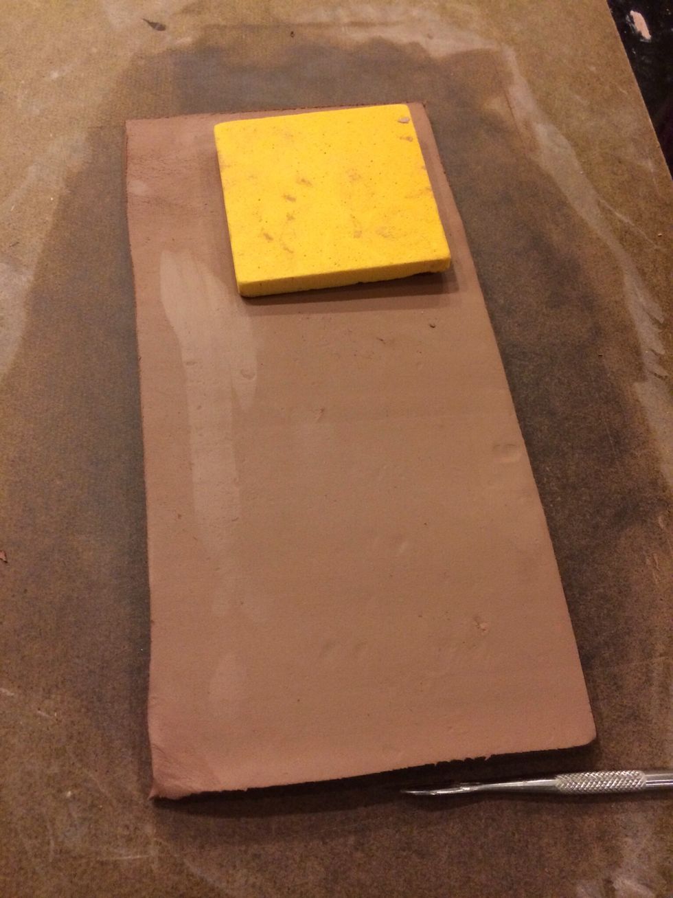 Cup 2 this will be more like a tea cup with a fancy foot. For this cup I am going to place the foam mold on top of the clay slab and press the mold into to clay.