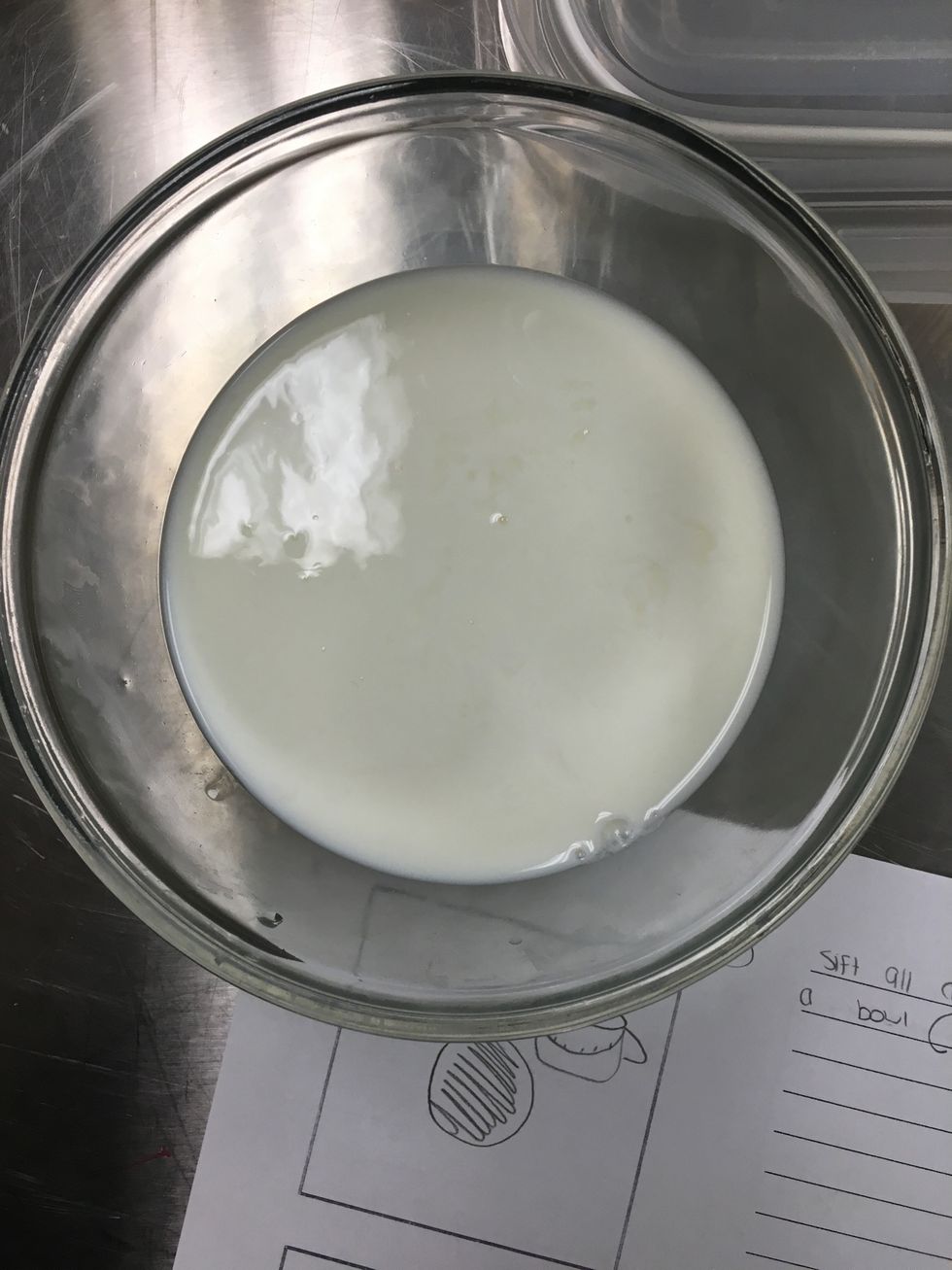 Curdle the milk by pouring the vinegar in the milk. Then, boil the water in a saucepan.