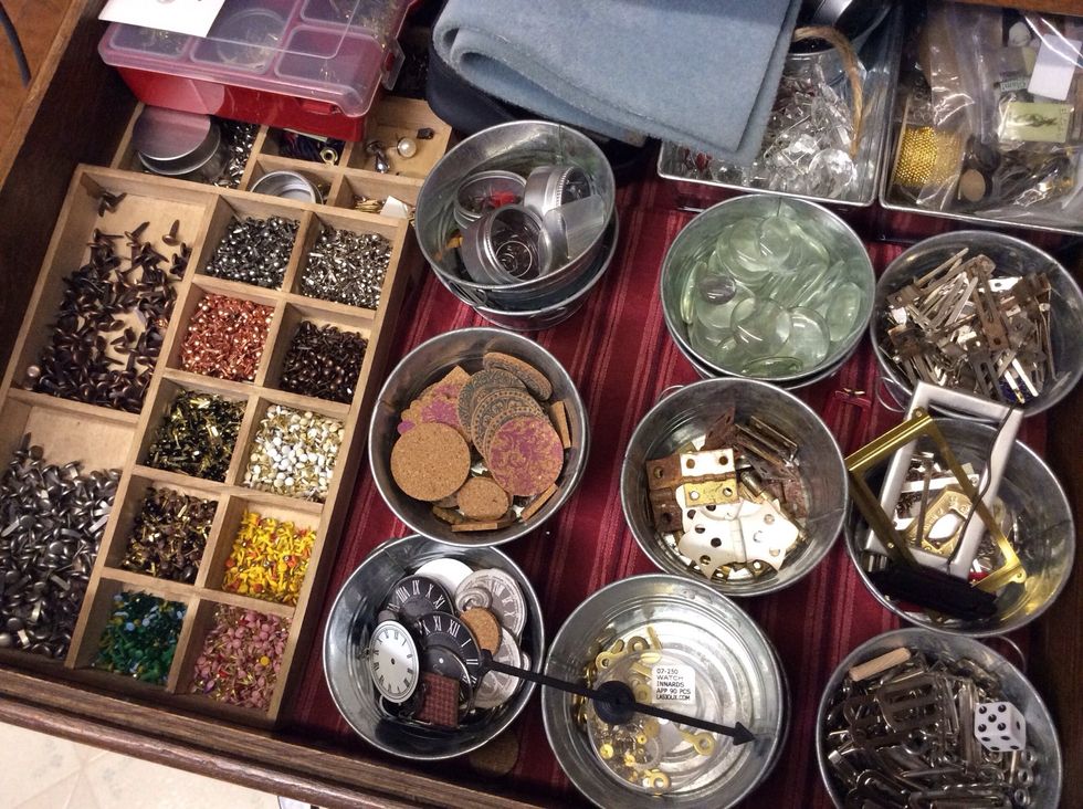 Curio box dividers and little metal tins stored in built-ins. Not only are these great for storage, I can also grab a tin and go if I'm working on the road.