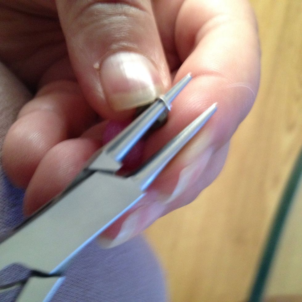 Curl end off rod around the pliers