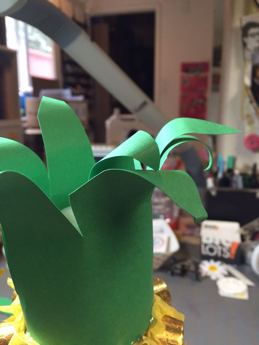 Curl fronds around a pencil to add shape.