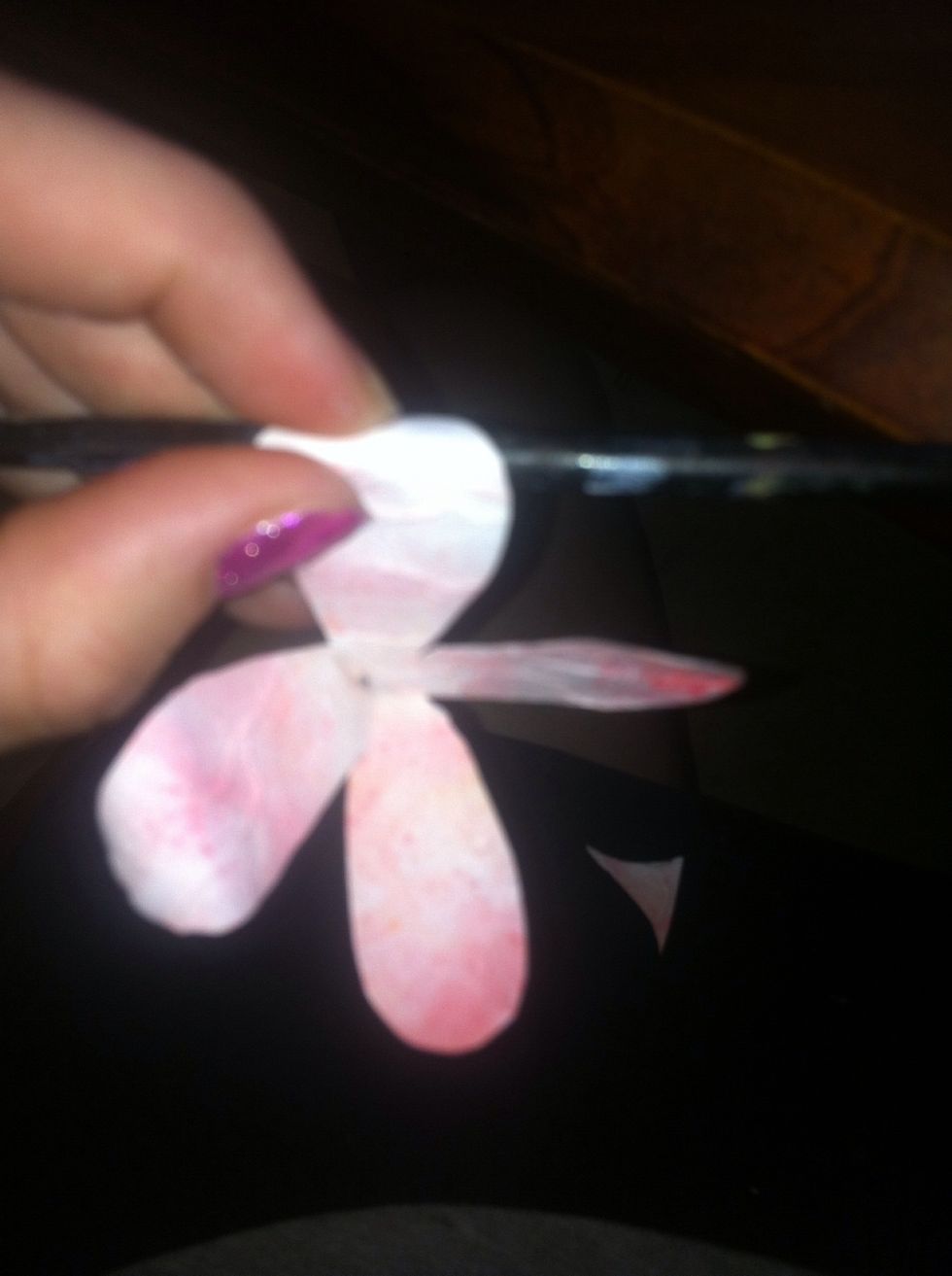 Curl the petals with your paint brush to make it look realistic
