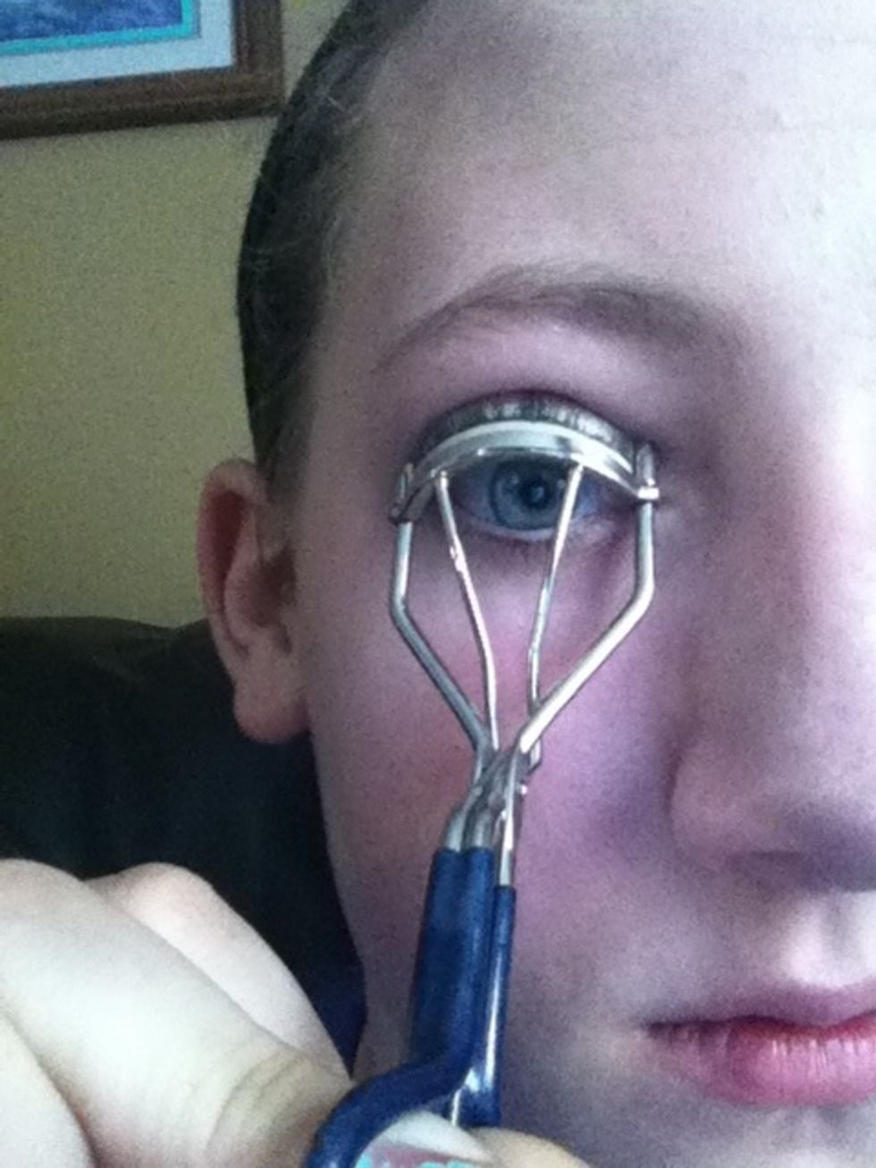 Curl your eyelashes with an eyelash curler