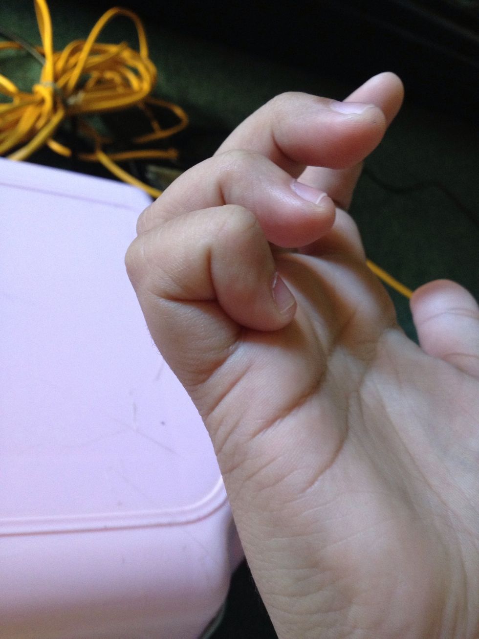 Curl your pinky into a box. You'll also see a letter "Y".