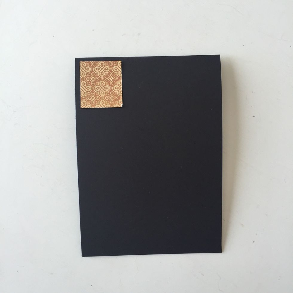 Cut 1 1/2" square of Gilded Grandeur and attach to top left corner (Add some gold paint to gild edges before adhering, if desired.) Leave at least 1/8 inch border of the base card exposed.