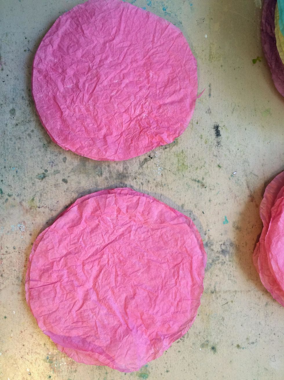 Cut 1/2 inch off of the edge of 3 of your coffee filters so you have 3 smaller and 3 regular size. The 3 smaller will be the inside part of the flower.