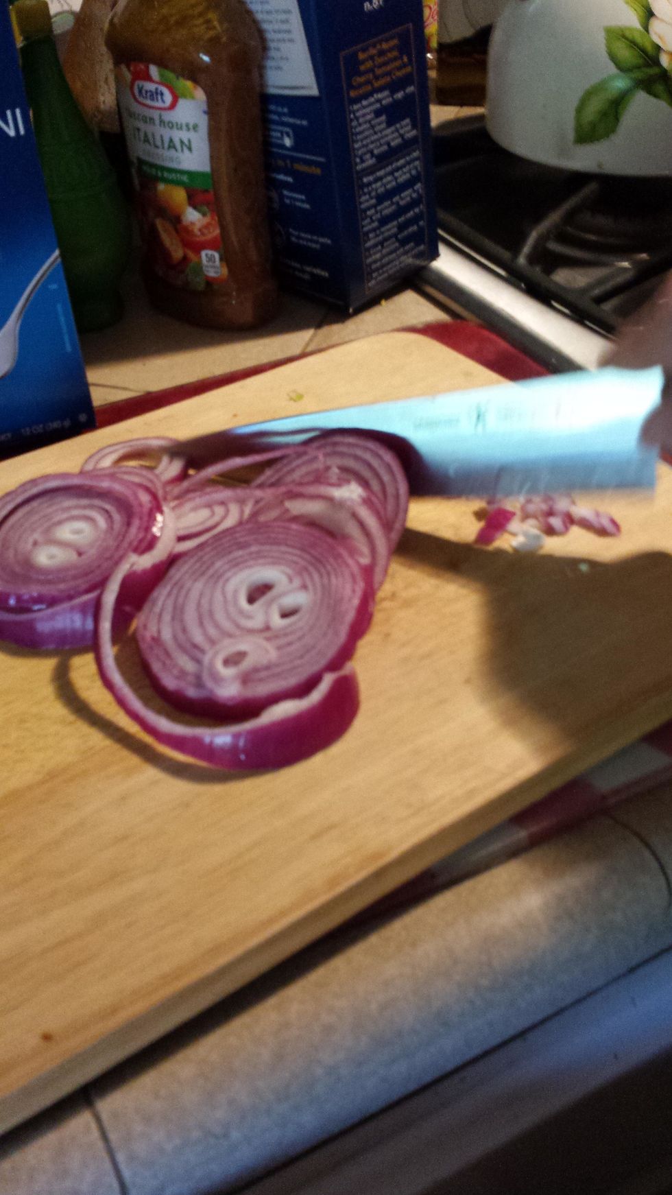 Cut 1/2 of an onion into tiny pieces and add it to the bowl.