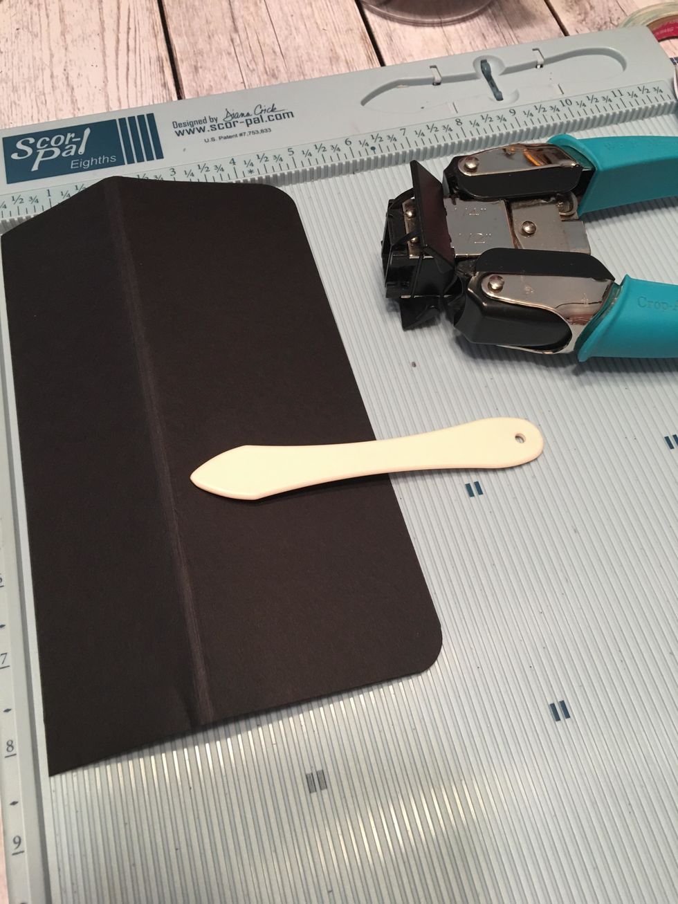 Cut 1 each card stock 8 1/4" x 5" and score the 5" side @ 2" & 2 1/8" to create a flap for the transparency pocket. Corner round the two corners opposite the fold line in the 2" section as shown.