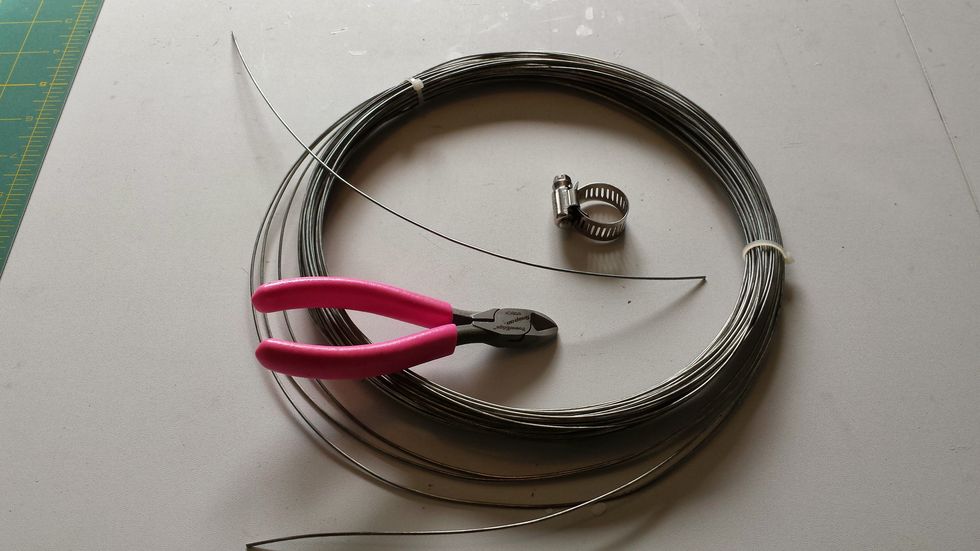 Cut 18 pieces of wire in approximately 1 foot sections. Longer or shorter depending on how far down your bottle needs to hang on your chandelier.