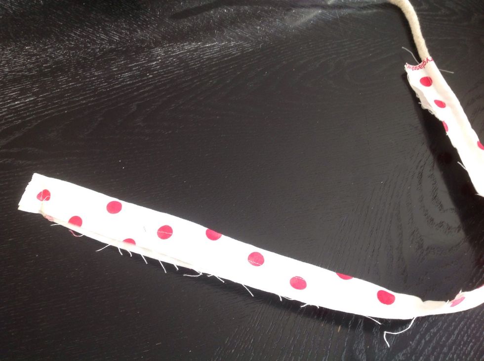 Cut 2 1/2 inch strips and sew on to cord.