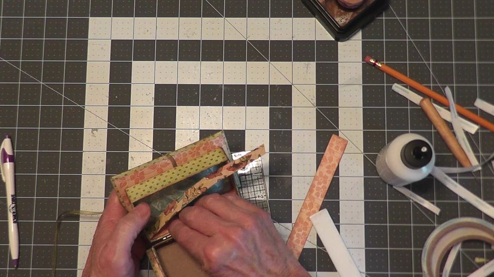 Cut 2 each 12"wide x 3/4" tall paper strips to pattern the inside walls of each box section.  Use glue and start at one corner, wrap & attach all the way around on the inside, crease corners as needed