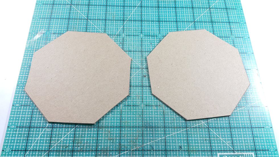 Cut 2 octagon shape of 4-7/8" width from chipboard for top and bottom of the teapot, cover one of these with papers on one side.