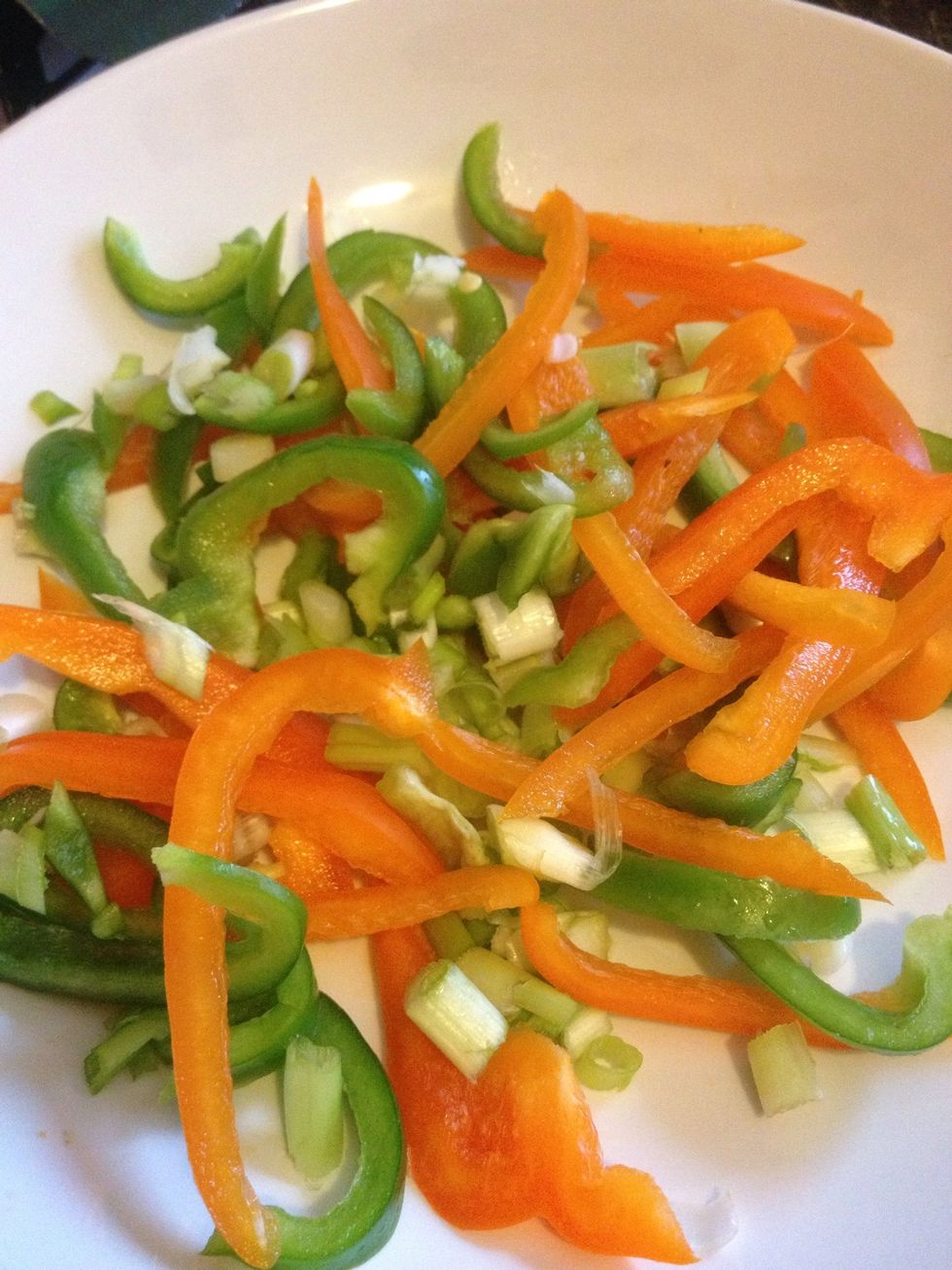 Cut 2 peppers into thin strips and finely chop 3 spring onions