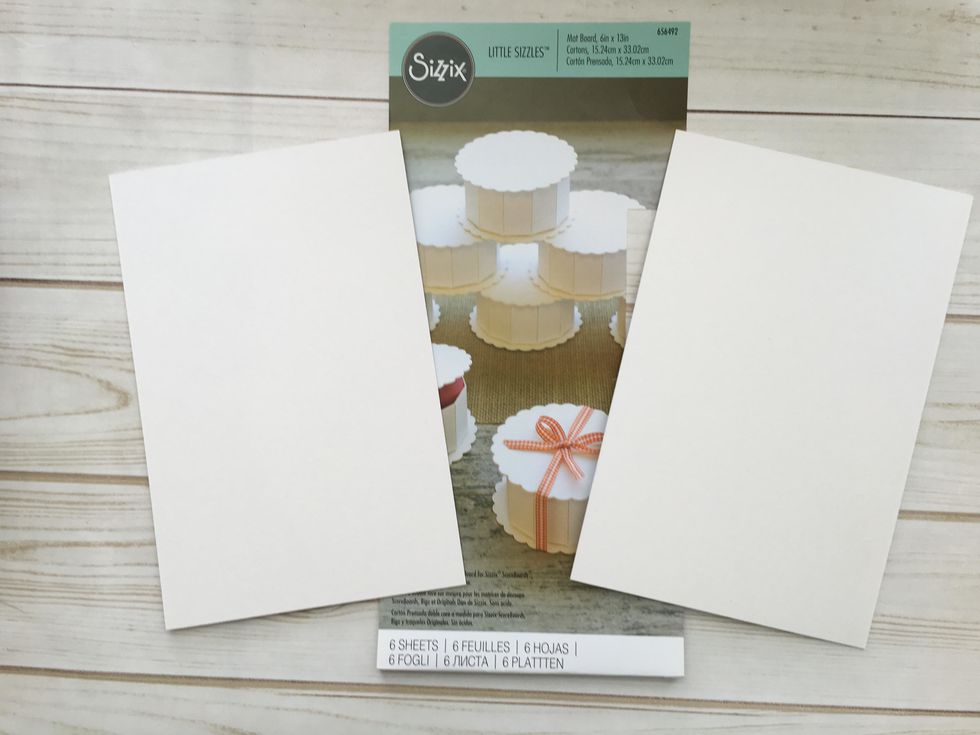 Cut 2 pieces of matboard or chipboard 5 1/2" x  9 1/4" for the covers.  I use Sizzix mat board but you can use medium weigh chipboard.  If the material is not thick enough, it will not score properly.