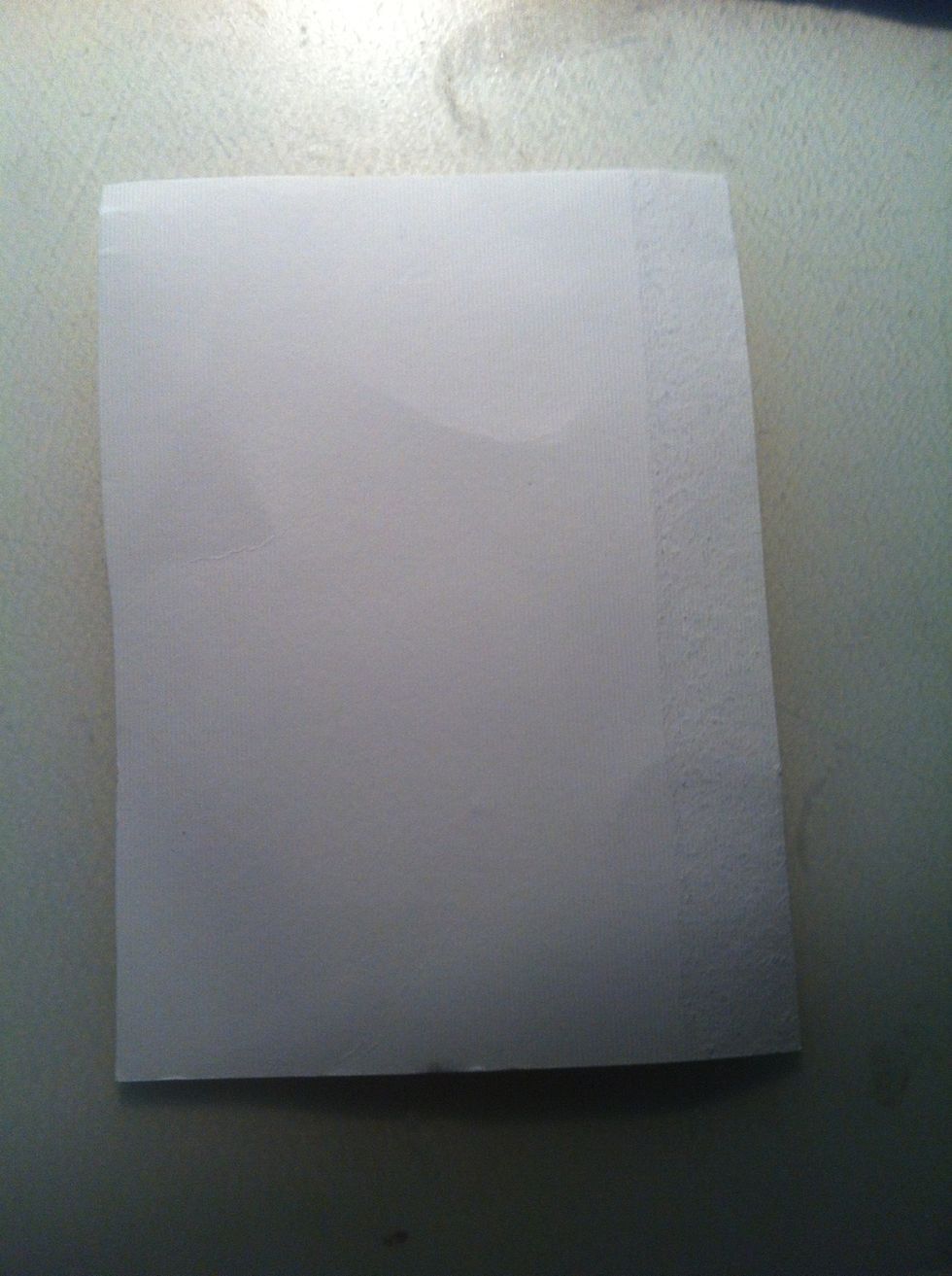 Cut 2 rectangles of cardboard so they will fit inside the case. One for each half! Mine are roughly 9cm across and 12.5 down. You can do this with wadding too - it will make your case even stronger!