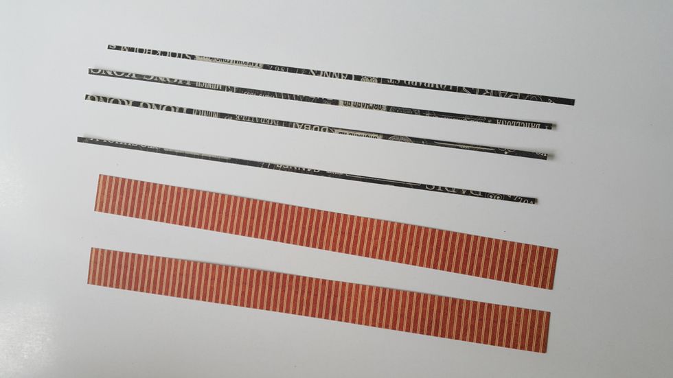 Cut 2 strips 1" and 4 strips 1/8" from papers.